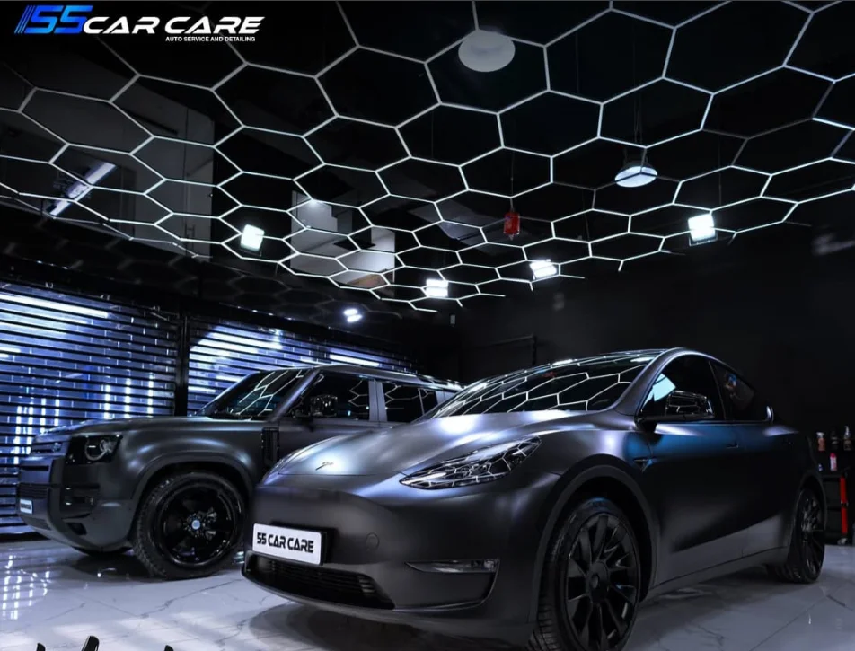 Two cars in the 55 Car Care facility